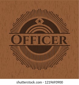 Officer badge with wooden background