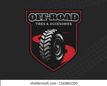 Offroad tires store emblem on dark backgound.