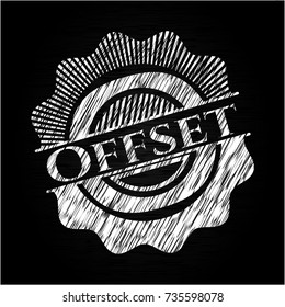Offset chalk emblem written on a blackboard