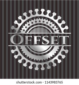Offset silvery badge or emblem