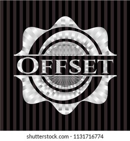 Offset silvery emblem