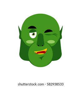 Ogre winking Emoji. Goblin happy emotion isolated. Green monster face
