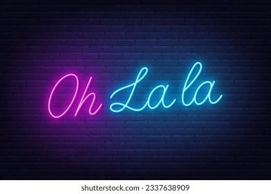 Oh la la neon lettering on brick wall background.