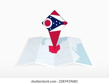 Ohio is depicted on a folded paper map and pinned location marker with flag of Ohio. Folded vector map.