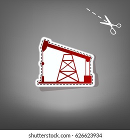 Oil drilling rig sign. Vector. Red icon with for applique from paper with shadow on gray background with scissors.