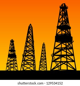 Oil rig silhouettes and orange sky. Vector illustration, eps10, contains transparencies, gradients and effects.