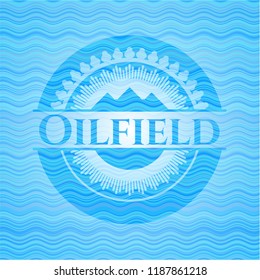 Oilfield light blue water wave emblem.