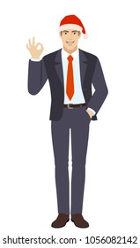 OK! Businessman in Santa hat showing a okay hand sign. Full length portrait of businessman in a flat style. Vector illustration.
