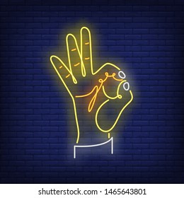 OK gesture neon sign. Okay, hand, approval, success. Gestures concept. Night bright advertisement. Vector illustration in neon style, glowing element for banners, posters, flyers