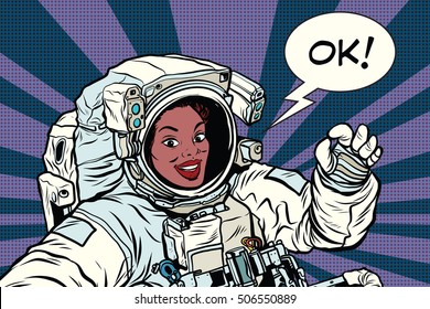 OK Gesture Woman Astronaut In A Spacesuit, Pop Art Retro Comic Book Vector Illustration