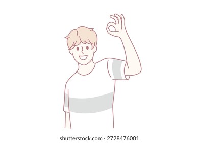 Ok y el concepto de signo de buena suerte. Muchacho positivo sonriente que lleva la camiseta que se coloca que muestra la buena señal con los dedos que sienten la Ilustración vectorial alegre