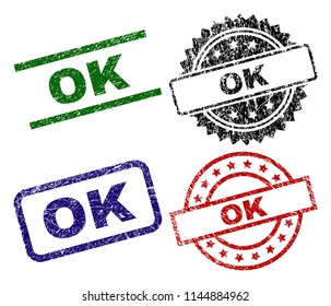 OK seal prints with distress surface. Black, green,red,blue vector rubber prints of OK title with unclean surface. Rubber seals with circle, rectangle, medallion shapes.