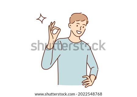 Ok sign and gesture language concept. Young smiling man cartoon character standing showing ok sign with fingers looking at camera vector illustration 