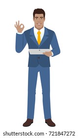 OK! Smiling businessman show a okay hand sign and holding digital tablet PC. Full length portrait of Black Business Man in a flat style. Vector illustration.