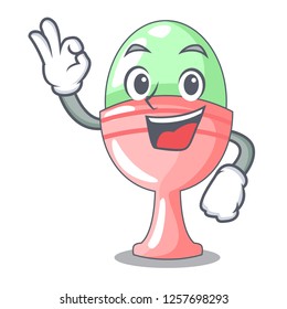 Okay colored easter egg in cup cartoon