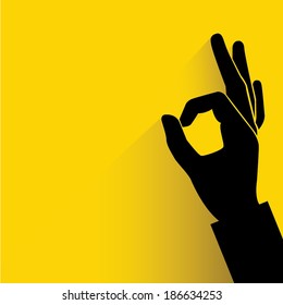 Okay Hand Sign Yellow Background