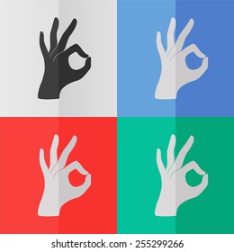 Okay vector icon. Effect of folded paper. Colored (red, blue, green) illustrations. Flat design