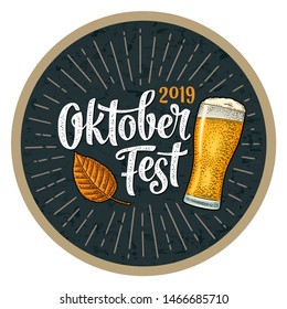 OktoberFest 2019 calligraphic handwriting lettering with rays. Glass beer and leaf. Vector vintage engraving illustration on dark background. Advertising design for poster and coaster.