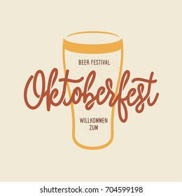 Oktoberfest beer festival typography emblem. Willkomen zum - Welcome in german. Beer related lettering. Hand crafted design elements for prints posters advertising. Vector vintage illustration.