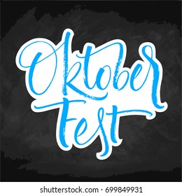 Oktoberfest blue and white lettering on chalkboard. Handwritten modern calligraphy, brush painted letters. Vector illustration. Template for banners, posters, merchandising, cards or photo overlays.