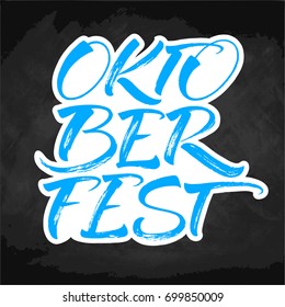 Oktoberfest blue and white lettering on chalkboard. Handwritten modern calligraphy, brush painted letters. Vector illustration. Template for banners, posters, merchandising, cards or photo overlays.