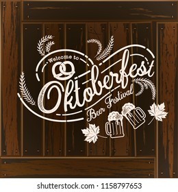 Oktoberfest hand drawn vector lettering and beer glass. Modern brush calligraphy. Wood background.