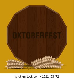 Oktoberfest poster with a beer barrel and wheat - Vector illustration