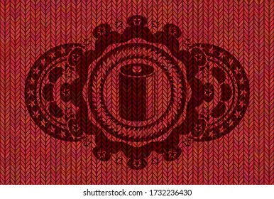 old battery icon inside Red woolen fabric emblem. Cloth exquisite background. Intense illustration. 