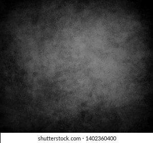 Old black background. Grunge texture. Dark wallpaper. Blackboard. Chalkboard