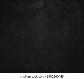 Old black background. Grunge texture. Dark wallpaper. Blackboard. Chalkboard