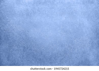 Old blue wall in spots, cracks, stains. Painted concrete wall in abstract grunge style. Grunge background texture for backgrounds, portraits, posters.
