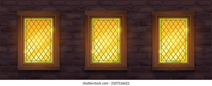 Old brick wall with glow stained glass windows at night. Vector cartoon illustration of medieval building facade with mosaic windows in wooden frame and stone wall