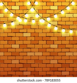 Old brick wall with realistic luminous garland.  Glowing lights lamp for holiday greeting card design. Round light bulbs with soft warm light effect