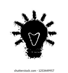 old bulb with light. simple single icon. Black ink with splashes on white background