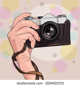 old camera with a case in your hand
