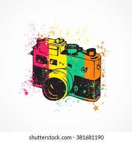 Old camera with dirty shapes on grunge background. vector illustration