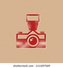 Old camera icon in halftone style. Grunge background vector illustration.