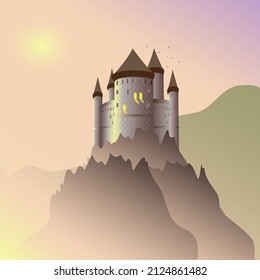 An old castle in the mountains at sunset