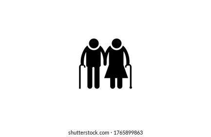 Old couple holding hands with walking sticks black flat icon isolated on white background