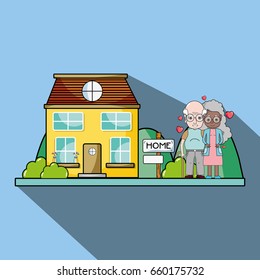 old couple together next their house with hearts