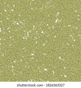 Old damaged mosaic composed of small triangular green pieces. Texture of deteriorated wallpaper.