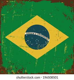 Old distressed metal sign with the Brazilian flag.