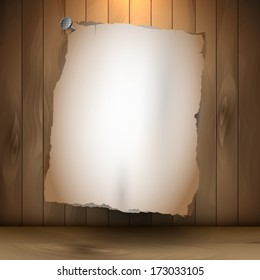 Old empty paper pinned on wooden background