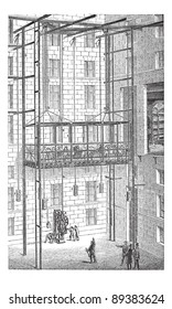 Old engraved illustration of Elevator in the Grand Opera of Paris, France. Industrial encyclopedia E.-O. Lami - 1875.
