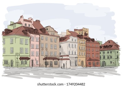 An old European city with colorful multi-story buildings. Many windows overlooking the street.