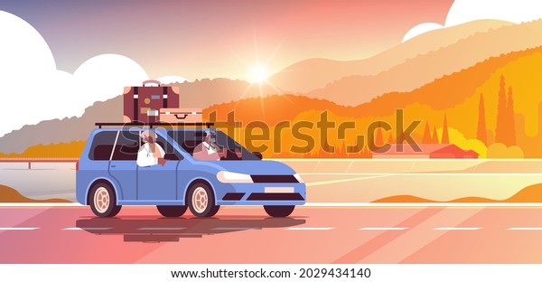 old\
family driving in car on weekly holiday senior african american\
travelers couple traveling by car active old\
age