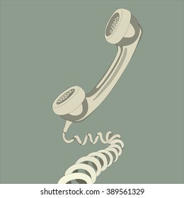 Old fashioned corded phone with the curled cord winding forward towards the viewer