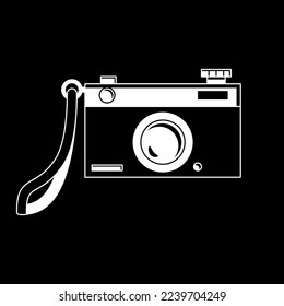 An old film camera. Vector cartoon illustration of a photo camera. Black and white, silhouette on black background. Isolated 