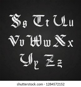 Old hand drawn gothic letters drawing with white chalk, S-Z symbols on chalkboard