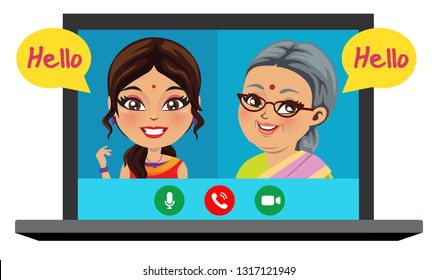 An old Indian woman is speaking on phone with her daughter/ grand daughter through a video call and is very happy.